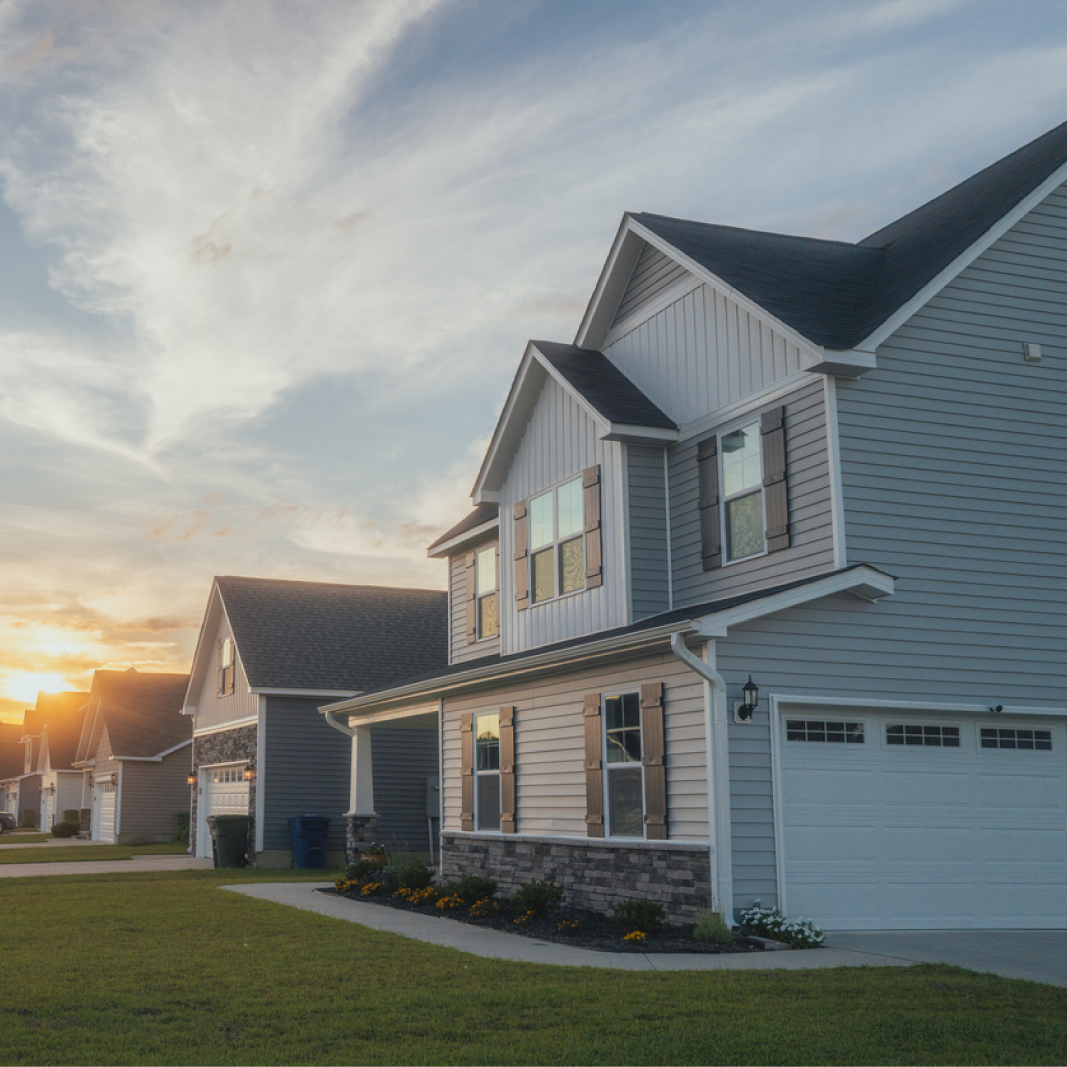 Row of newly built homes with sunset