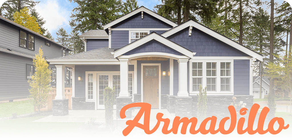 Blue two-story house with white trim and a stone base, covered porch, and a large orange 'Armadillo' watermark across the bottom.